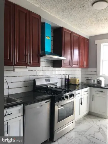 a view of a refrigerator in kitchen