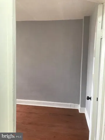 a view of a small space with wooden floor