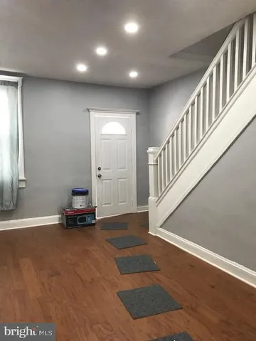 a view of an entryway with wooden floor