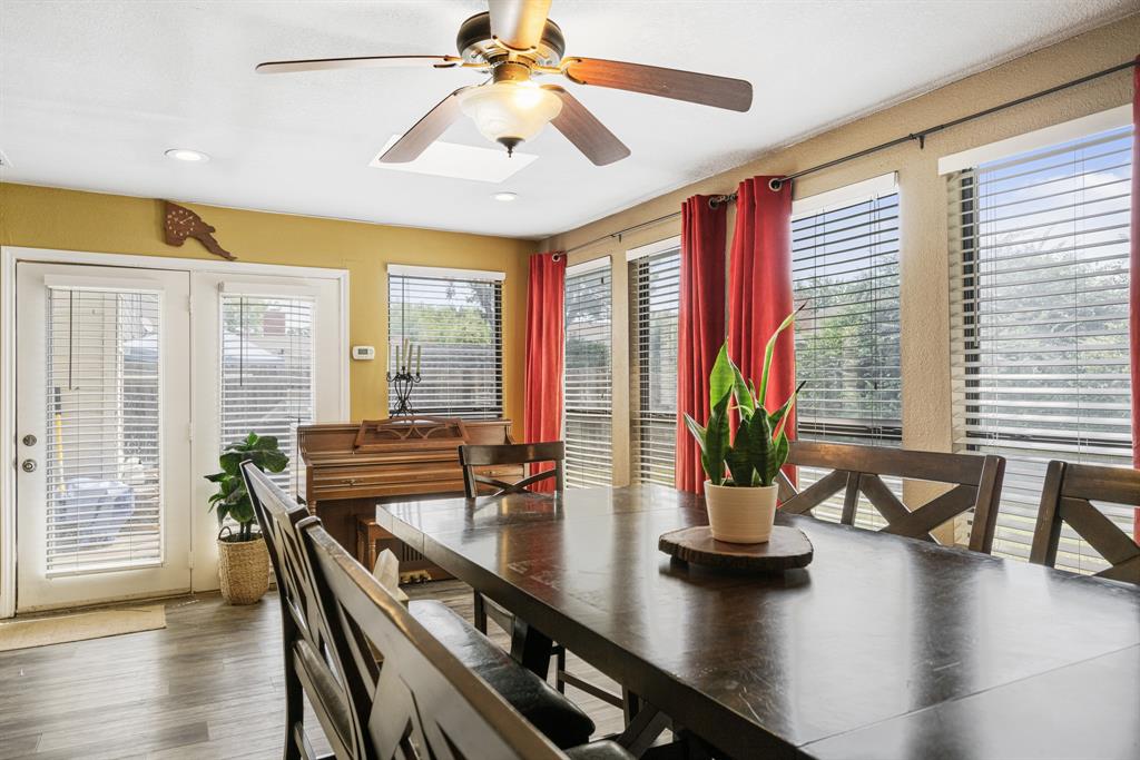 2877 Fenwick Street Grand Prairie, TX 75052 - Photo 13 of 27 a view of a dining room with furniture window and wooden floor