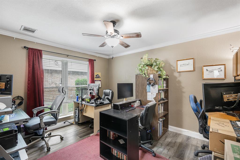 2877 Fenwick Street Grand Prairie, TX 75052 - Photo 16 of 27 a view of a workspace with furniture and a window