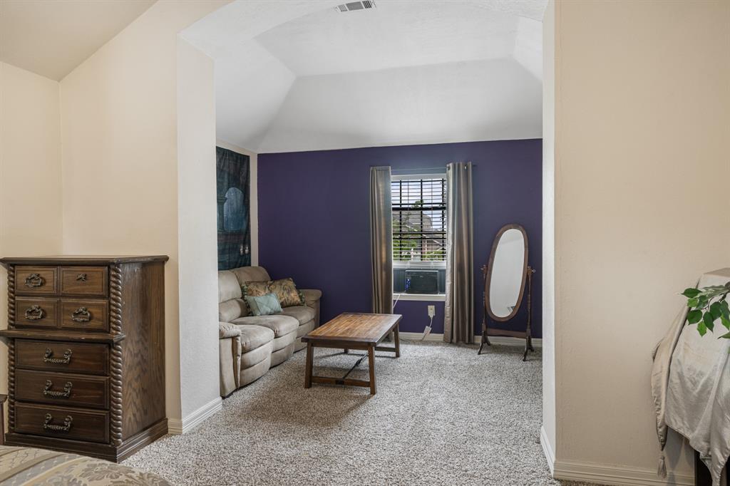 2877 Fenwick Street Grand Prairie, TX 75052 - Photo 18 of 27 a living room with furniture and a window
