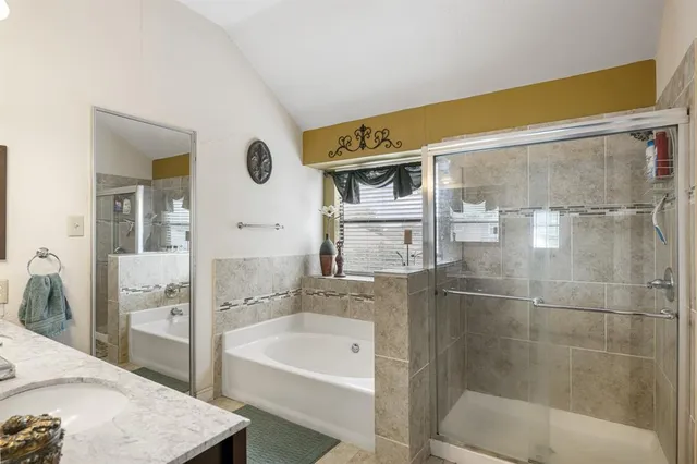 a bathroom with a bathtub and a sink