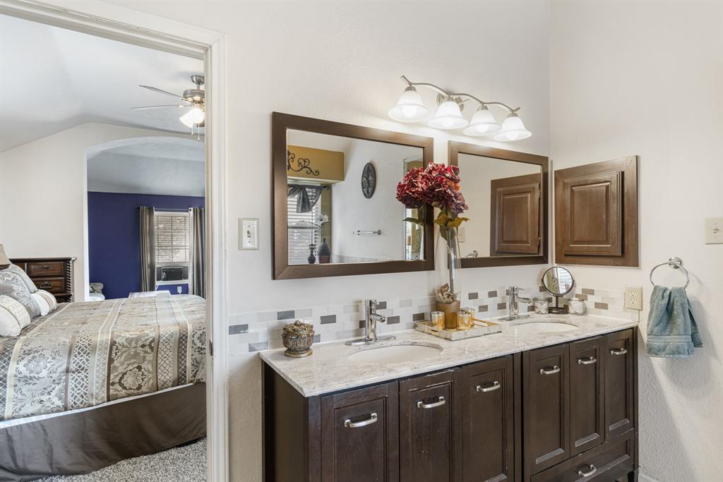 2877 Fenwick Street Grand Prairie, TX 75052 - Photo 20 of 27 a bathroom with a sink double vanity and a mirror