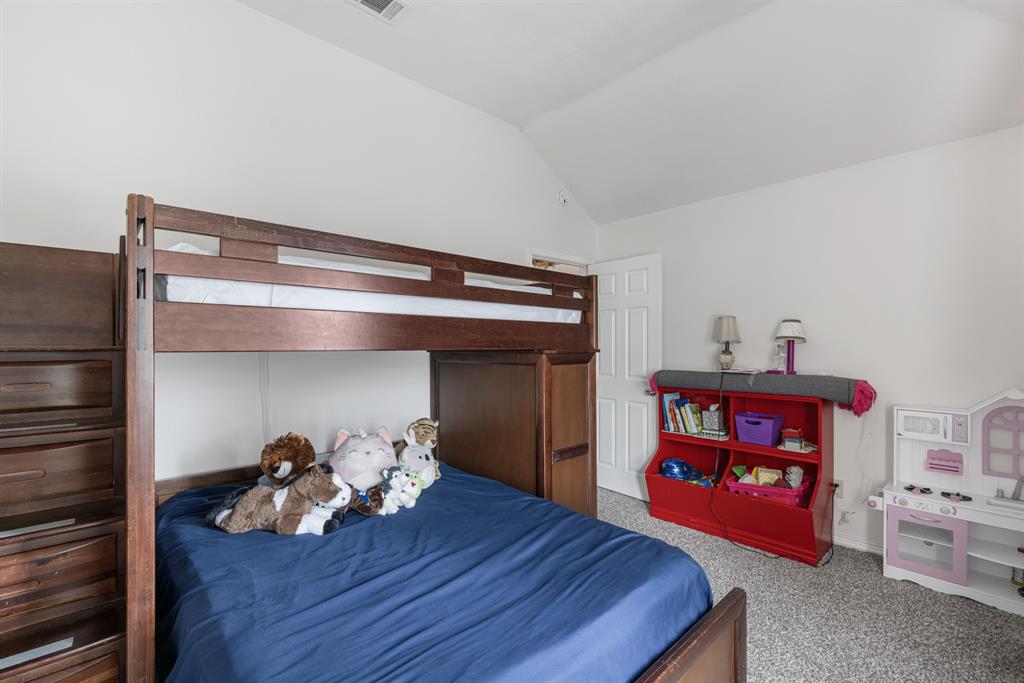 2877 Fenwick Street Grand Prairie, TX 75052 - Photo 21 of 27 a living room with furniture and a fireplace