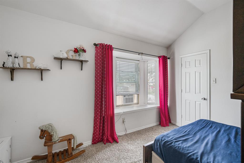 2877 Fenwick Street Grand Prairie, TX 75052 - Photo 22 of 27 a bed room with a bed and a window