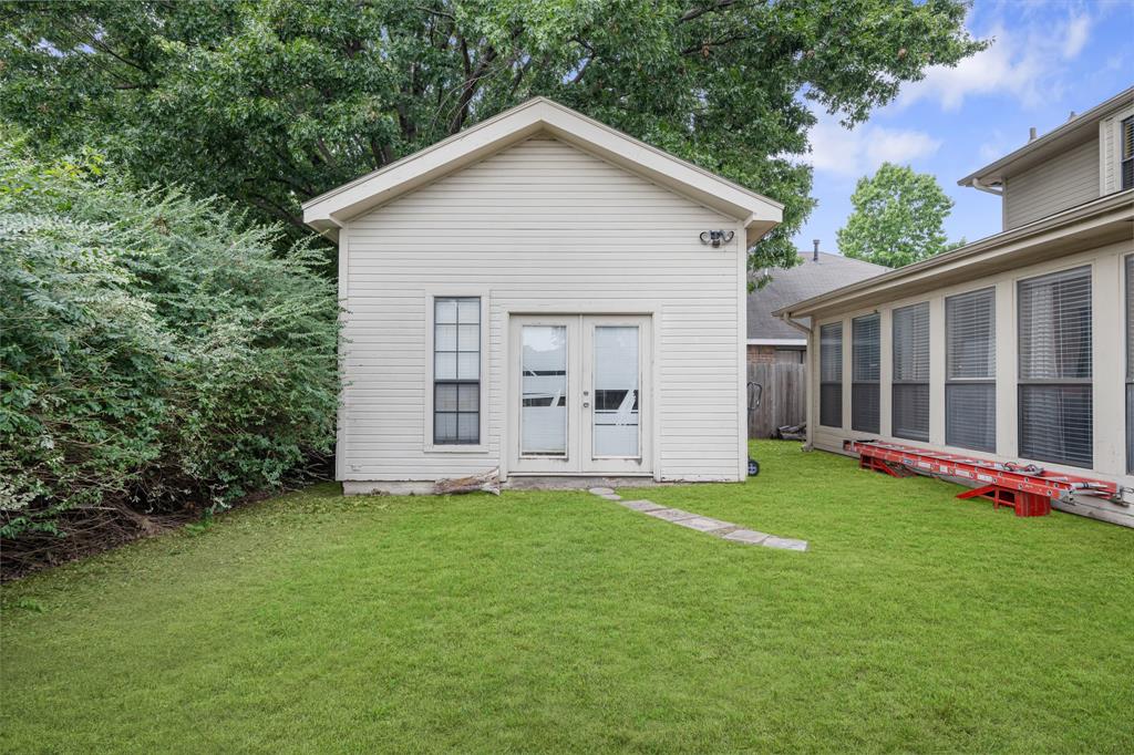 2877 Fenwick Street Grand Prairie, TX 75052 - Photo 26 of 27 a view of a house with a yard