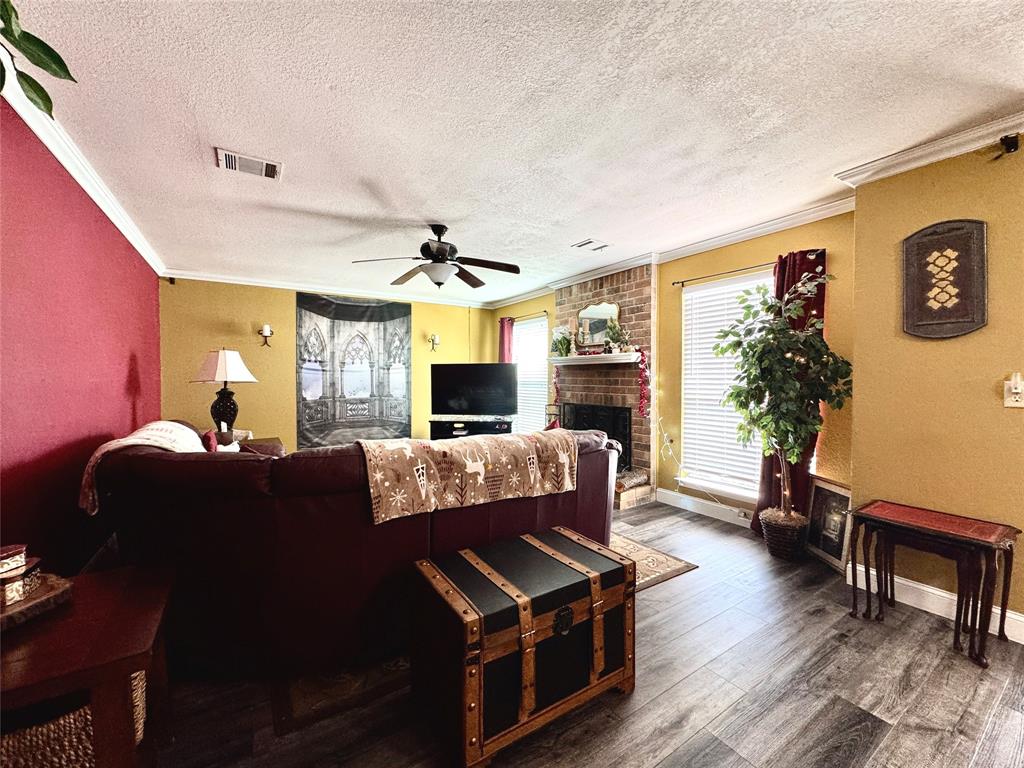 2877 Fenwick Street Grand Prairie, TX 75052 - Photo 5 of 27 a living room with furniture and a flat screen tv