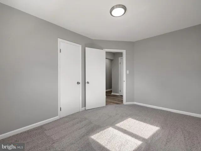 an empty room with a bathroom