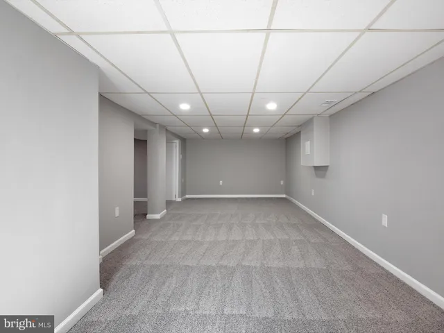 a view of a room with a white walls