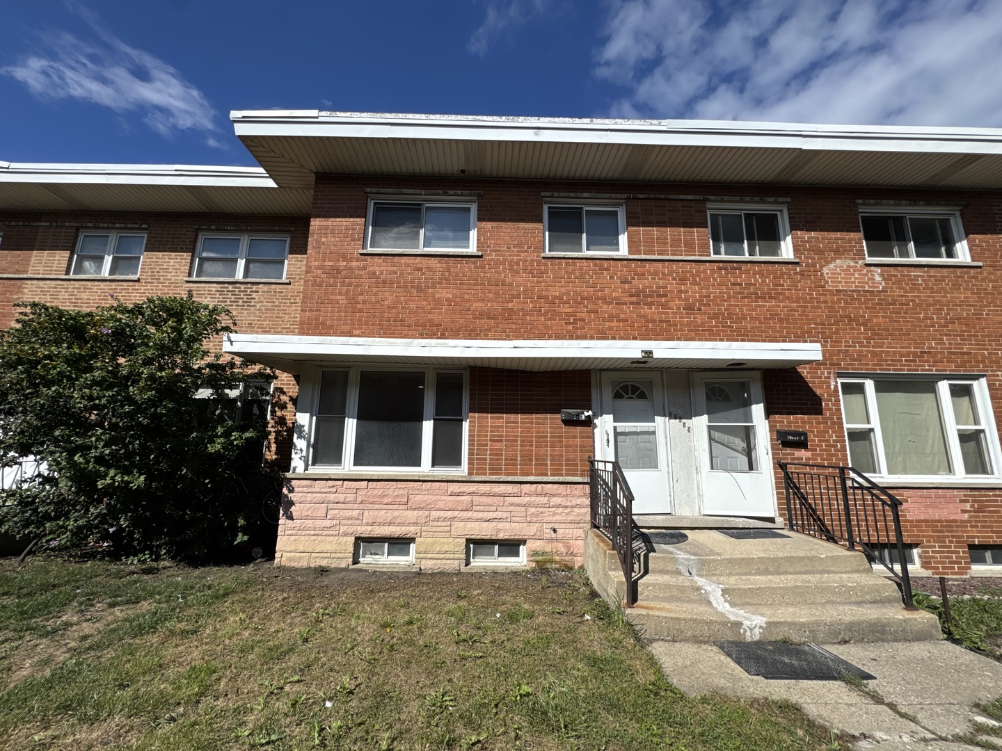 a house view with a garden space