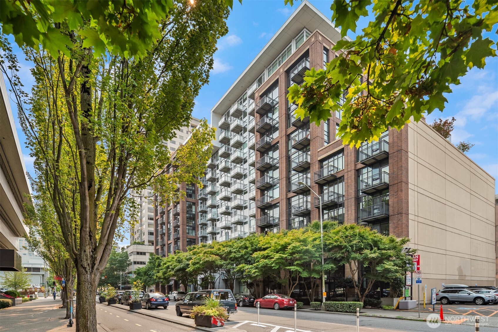 2911 2nd Avenue, Unit 310 Seattle, WA 98121 - Photo 37 of 40 a cars parked in front of a building