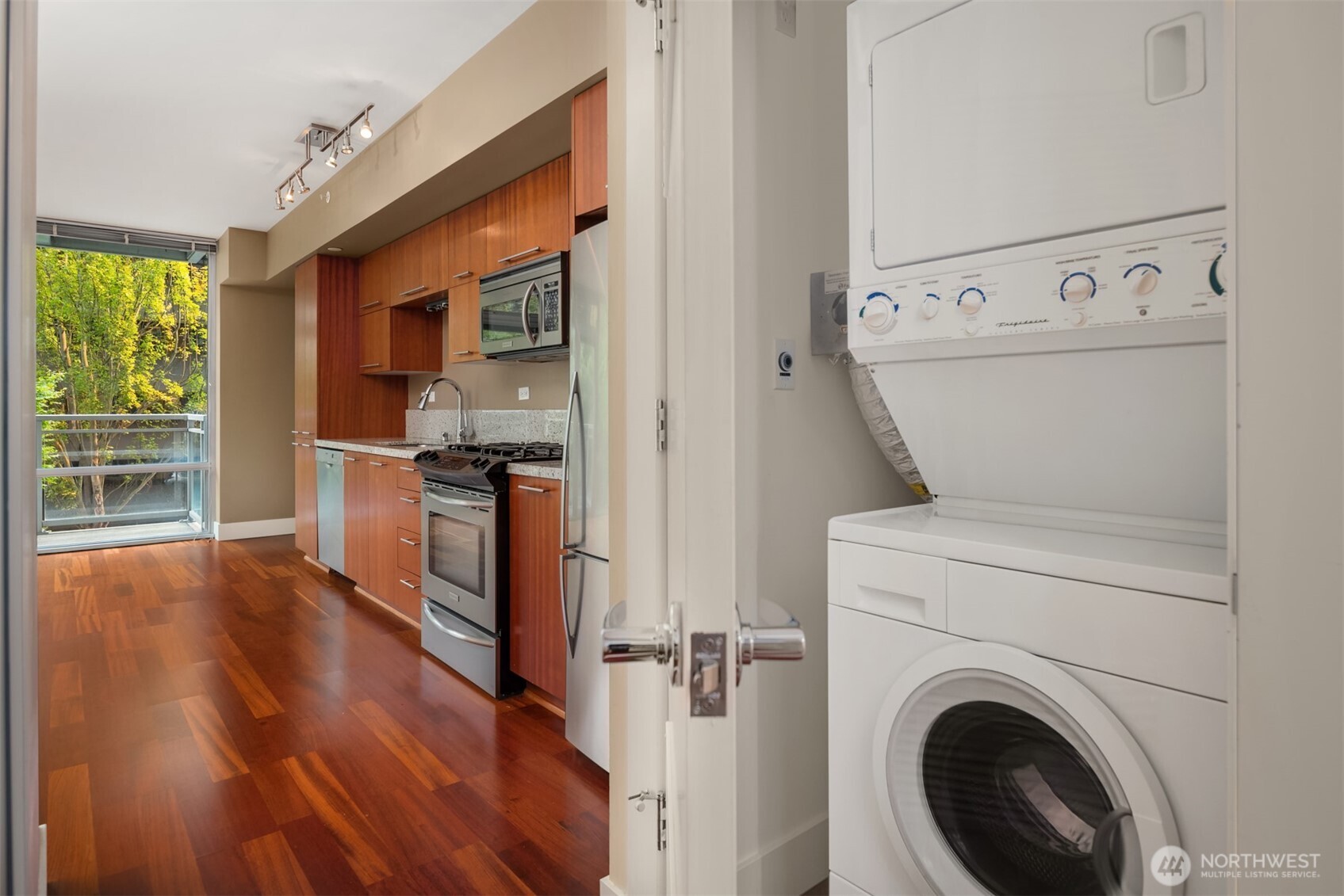 2911 2nd Avenue, Unit 310 Seattle, WA 98121 - Photo 8 of 40 a view of a kitchen with washer and dryer