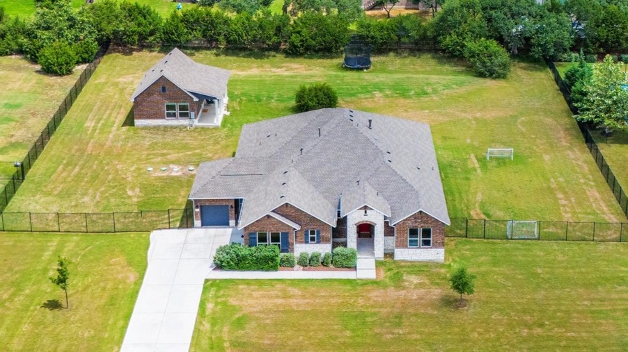 409 July Johnson Drive Austin, TX 78737 - Photo 1 of 1 a aerial view of a house with swimming pool and a yard
