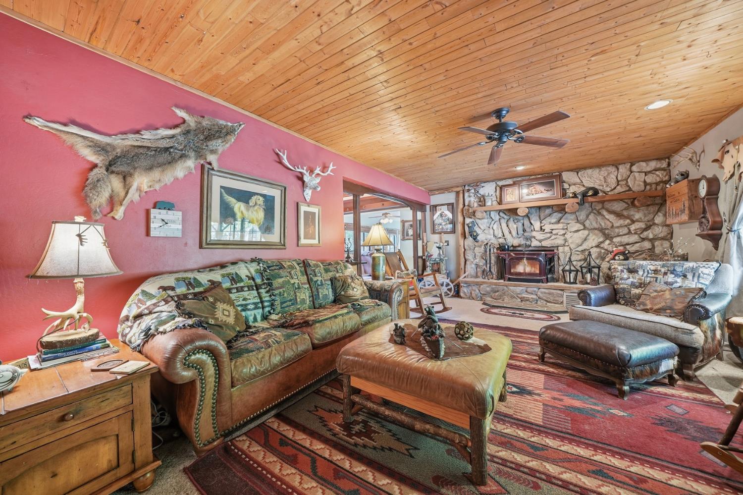 23140 Shake Ridge Road Volcano, CA 95689 - Photo 12 of 81 a living room with furniture ceiling fan and a rug