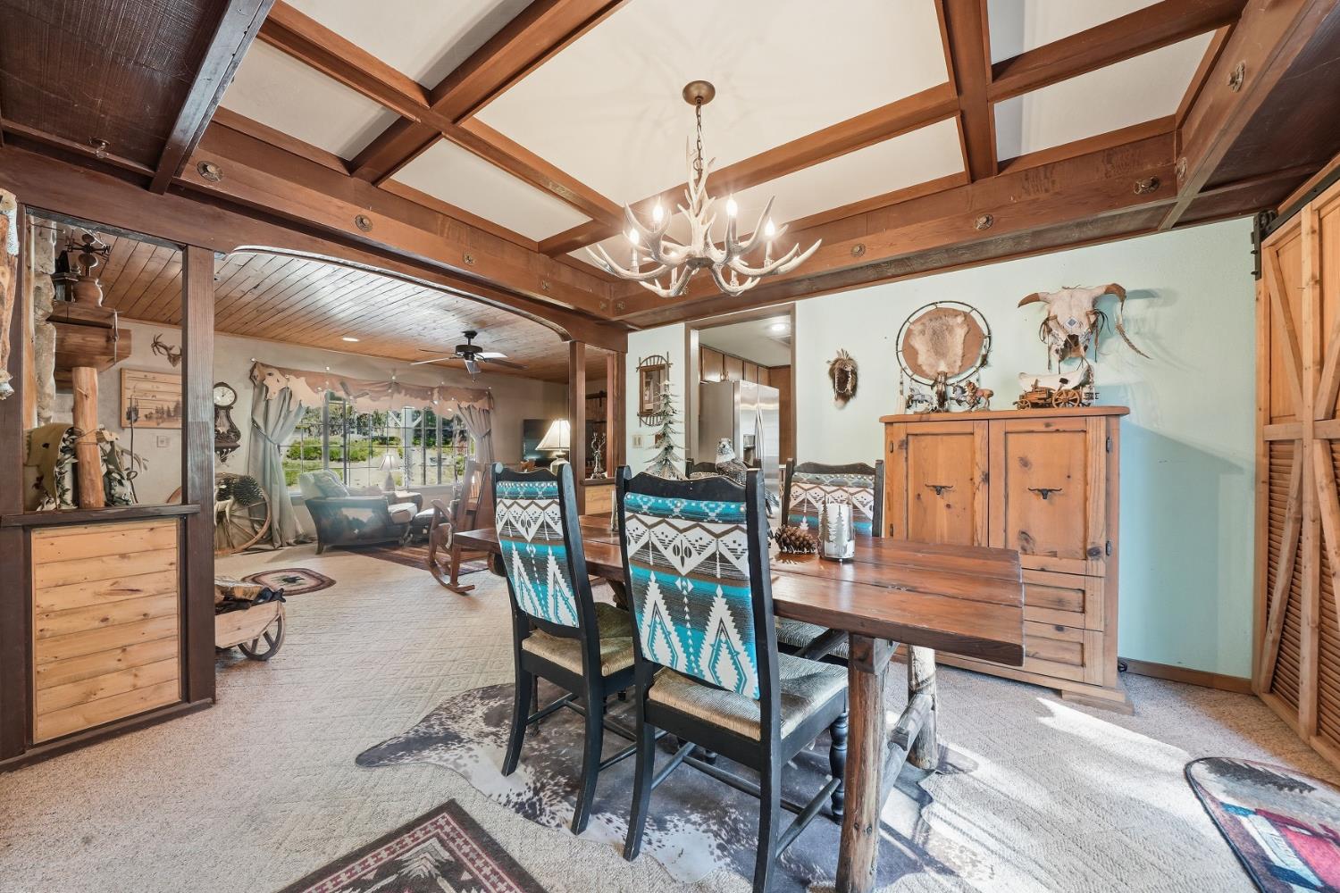 23140 Shake Ridge Road Volcano, CA 95689 - Photo 20 of 81 a view of a room with furniture and a chandelier