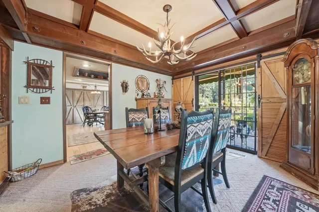 a kitchen with stainless steel appliances granite countertop a stove a refrigerator and a microwave