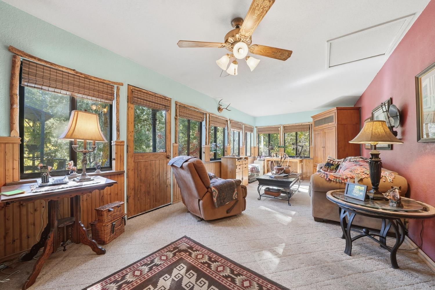 23140 Shake Ridge Road Volcano, CA 95689 - Photo 22 of 81 a living room with furniture and a large window