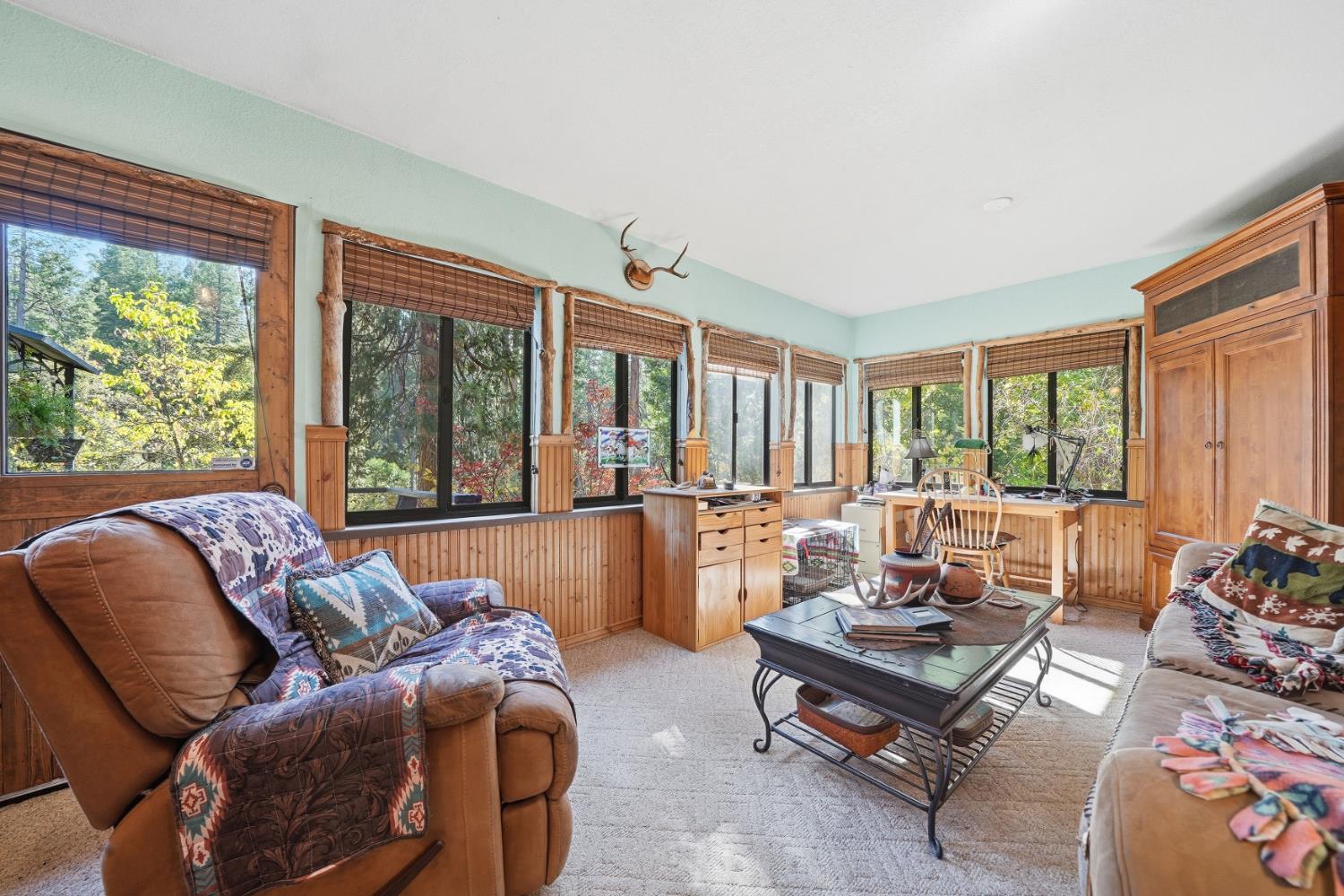 23140 Shake Ridge Road Volcano, CA 95689 - Photo 24 of 81 a living room with furniture and a large window