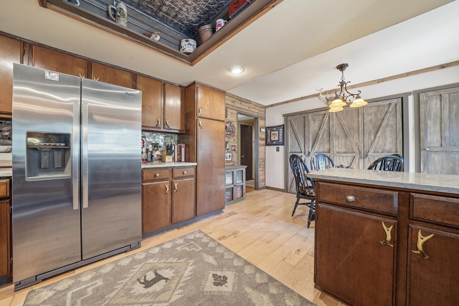 23140 Shake Ridge Road Volcano, CA 95689 - Photo 30 of 81 a kitchen with a refrigerator and a sink