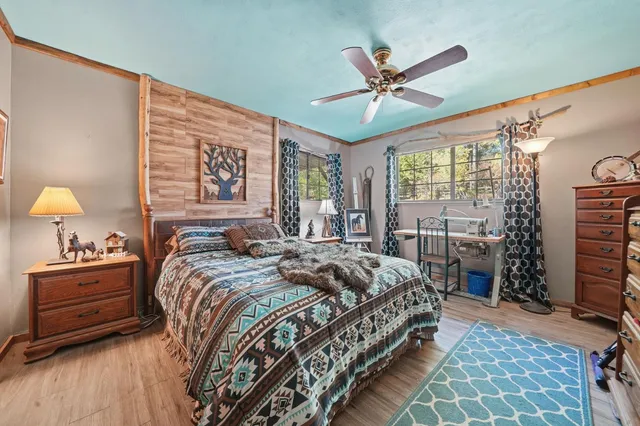 a backyard of a house with yard fountain and outdoor seating