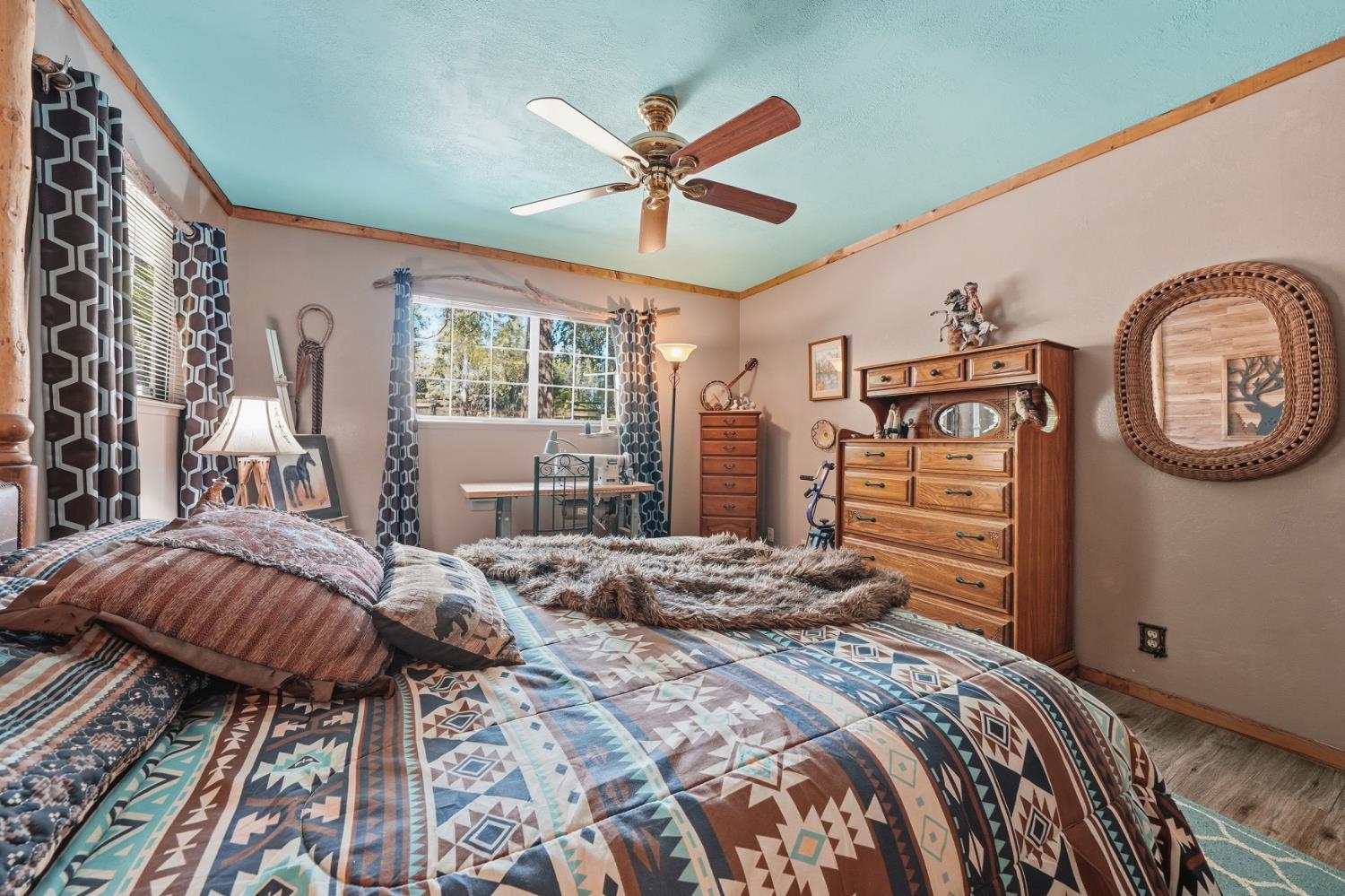 23140 Shake Ridge Road Volcano, CA 95689 - Photo 40 of 81 a bedroom with a large bed and a window