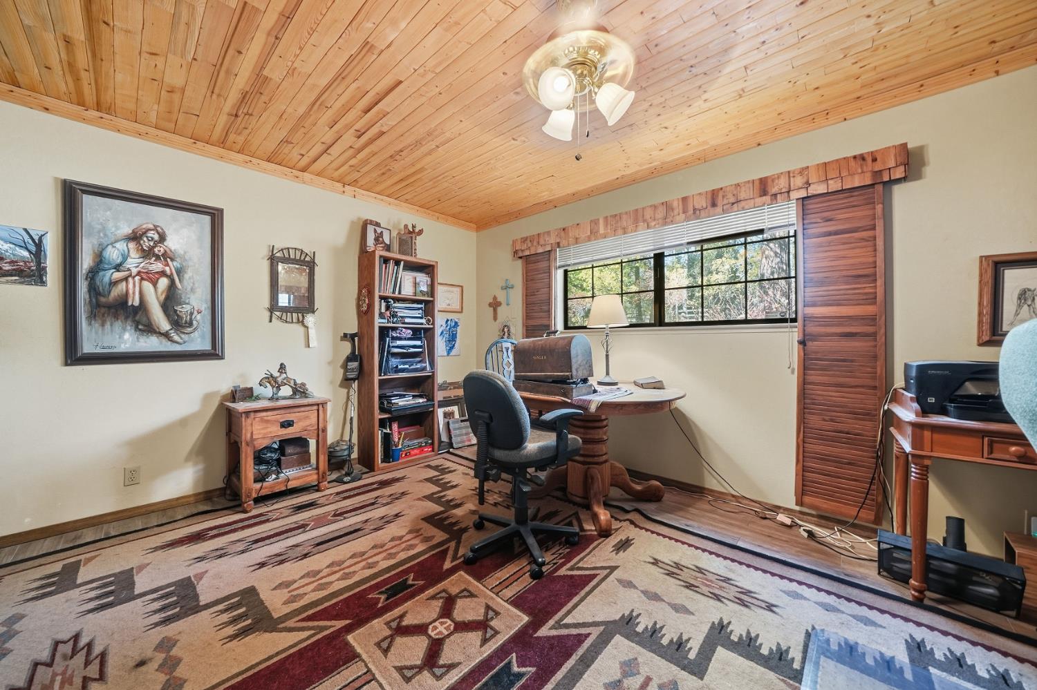 23140 Shake Ridge Road Volcano, CA 95689 - Photo 42 of 81 a work room with furniture and wooden floor