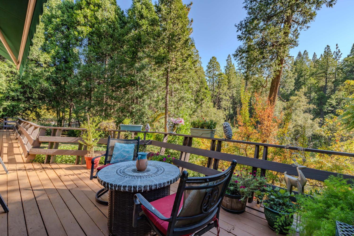 23140 Shake Ridge Road Volcano, CA 95689 - Photo 54 of 81 a view of a balcony with chairs and wooden floor