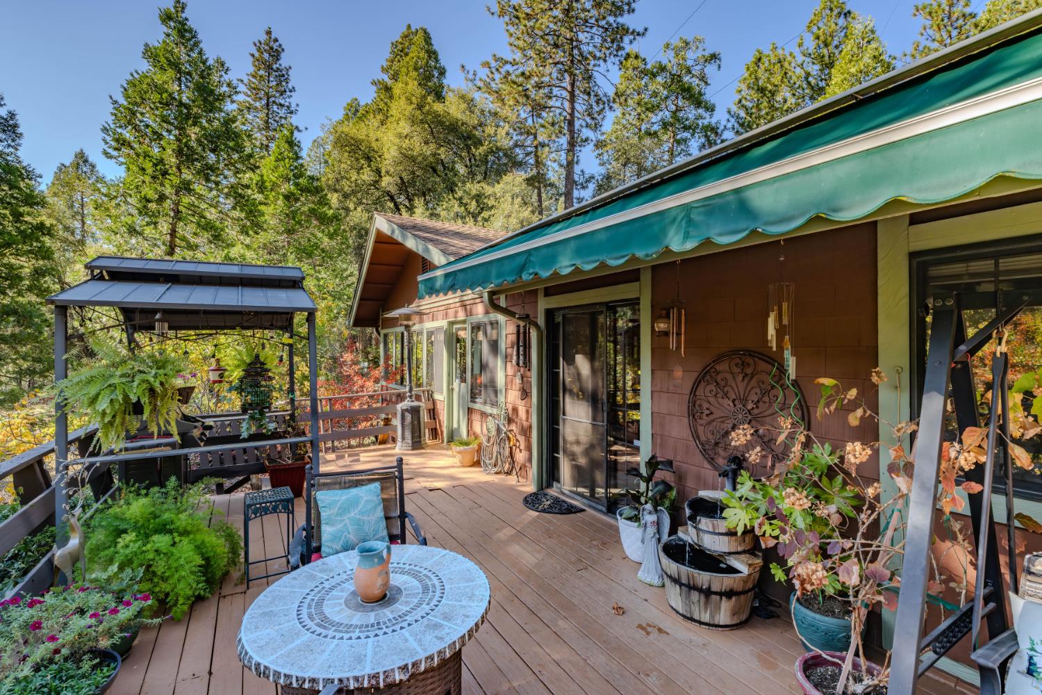 23140 Shake Ridge Road Volcano, CA 95689 - Photo 56 of 81 a backyard of a house with yard fountain and outdoor seating