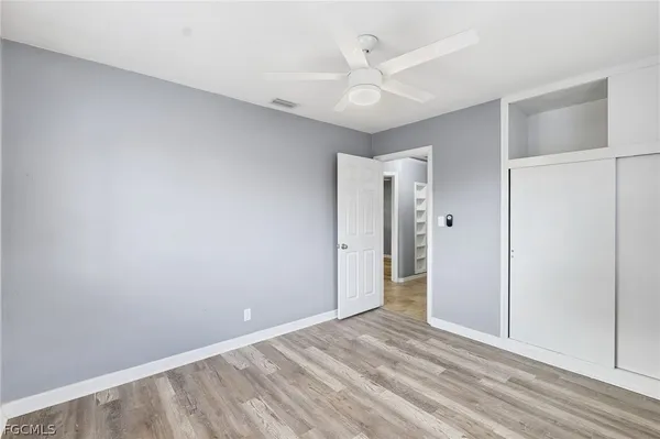 a view of an empty room with a fan