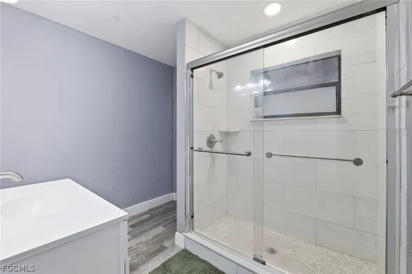 a bathroom with a bathtub and a shower