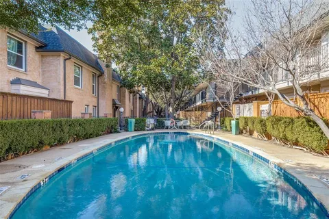 a view of pool in front of house
