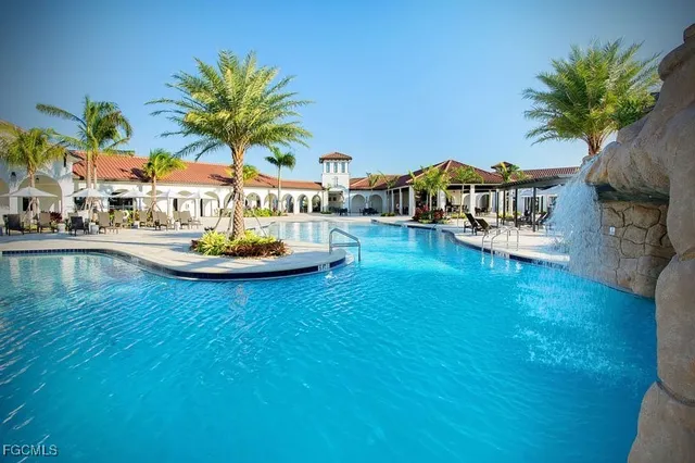 a view of a swimming pool and lounge chair