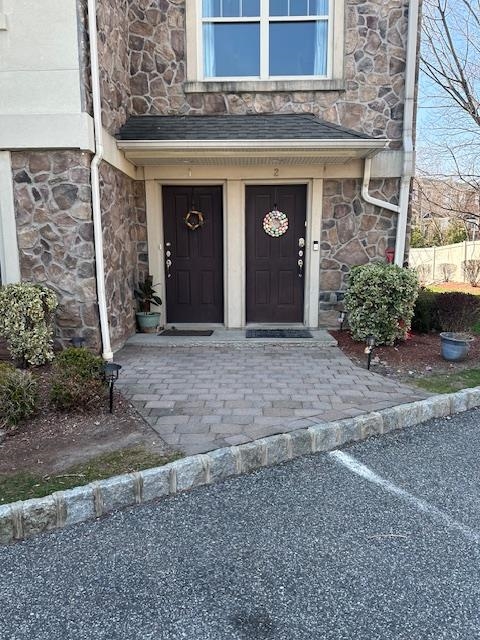 a front view of a building with garden