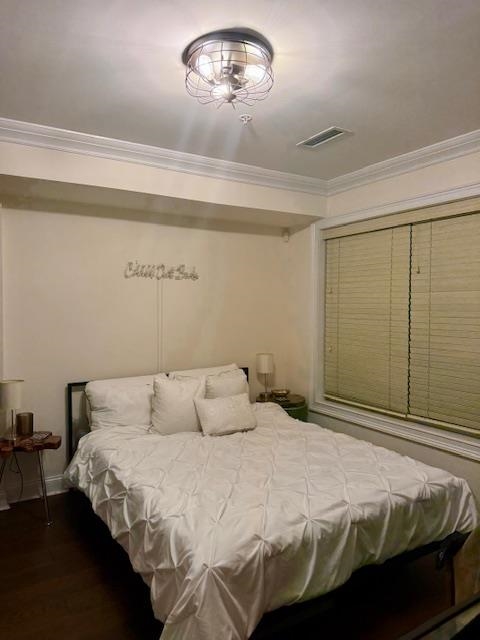 1625 Paterson Plank Road, Unit 1 Secaucus, NJ 07094 - Photo 13 of 19 a bedroom with a bed and a chandelier