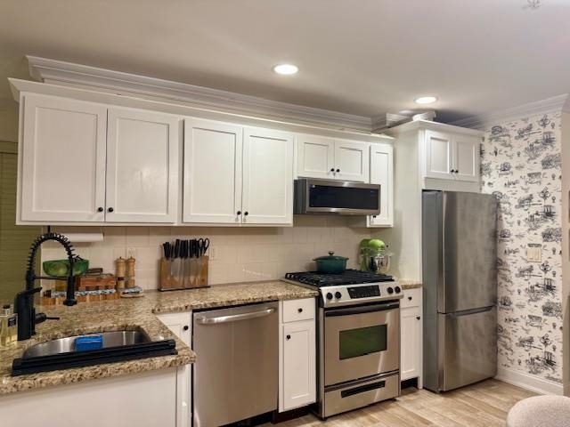 1625 Paterson Plank Road, Unit 1 Secaucus, NJ 07094 - Photo 7 of 19 a kitchen with refrigerator a stove a sink and cabinets