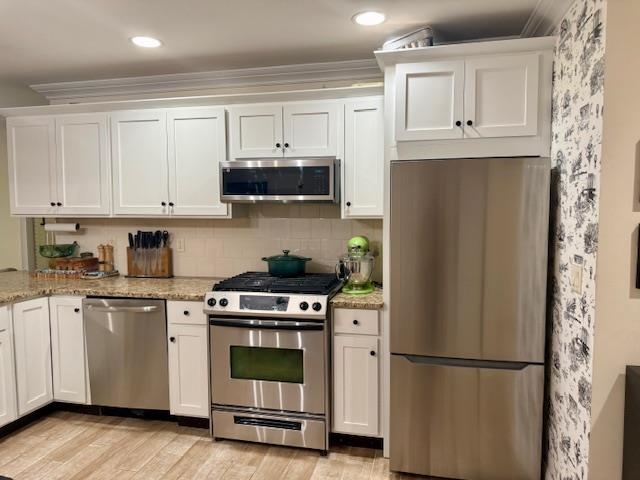 1625 Paterson Plank Road, Unit 1 Secaucus, NJ 07094 - Photo 8 of 19 a kitchen with stainless steel appliances white cabinets and a refrigerator