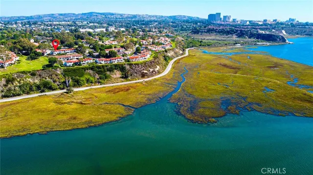 a view of a swimming pool with a table and chairs