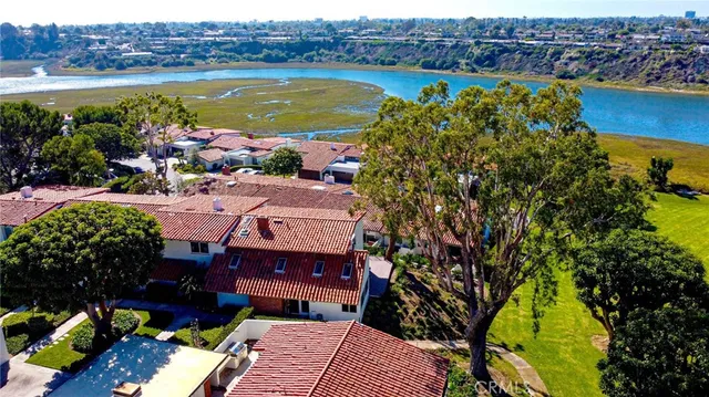 a view of a lake with a house in the background
