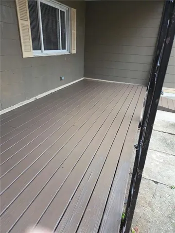 a living room with furniture a rug and a fireplace