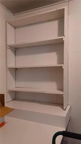 a view of storage and utility room with empty racks