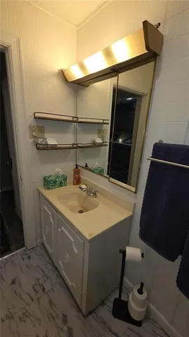 a bathroom with a toilet and a sink