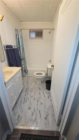 a bedroom with a bed and a fireplace