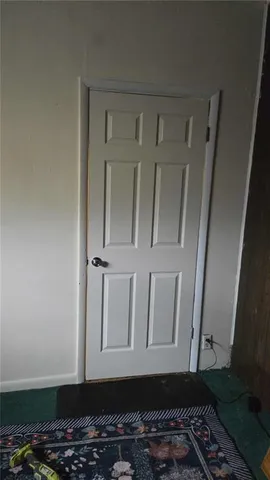 a kitchen with granite countertop a sink and cabinets