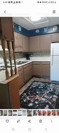 a view of a house with a street