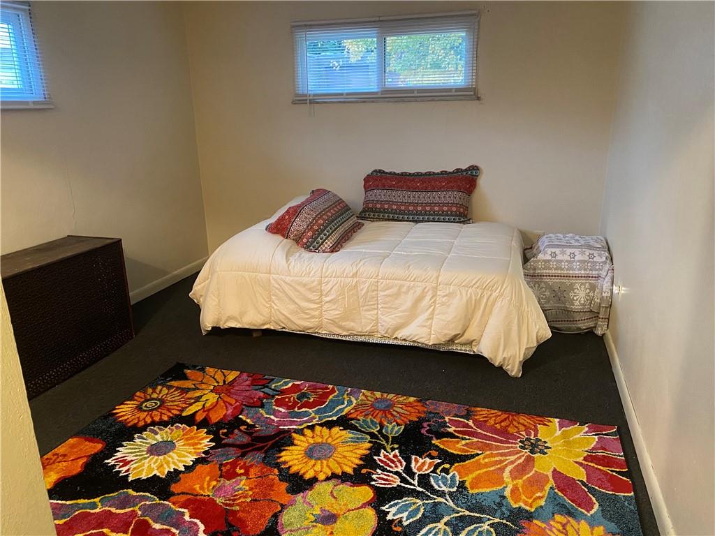 105 19th Street Pittsburgh, PA 15215 - Photo 4 of 40 a bed sitting in a bedroom next to a window