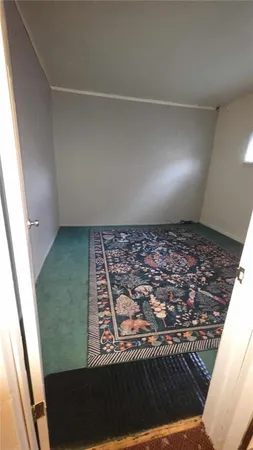 a living room with furniture a rug and a fireplace