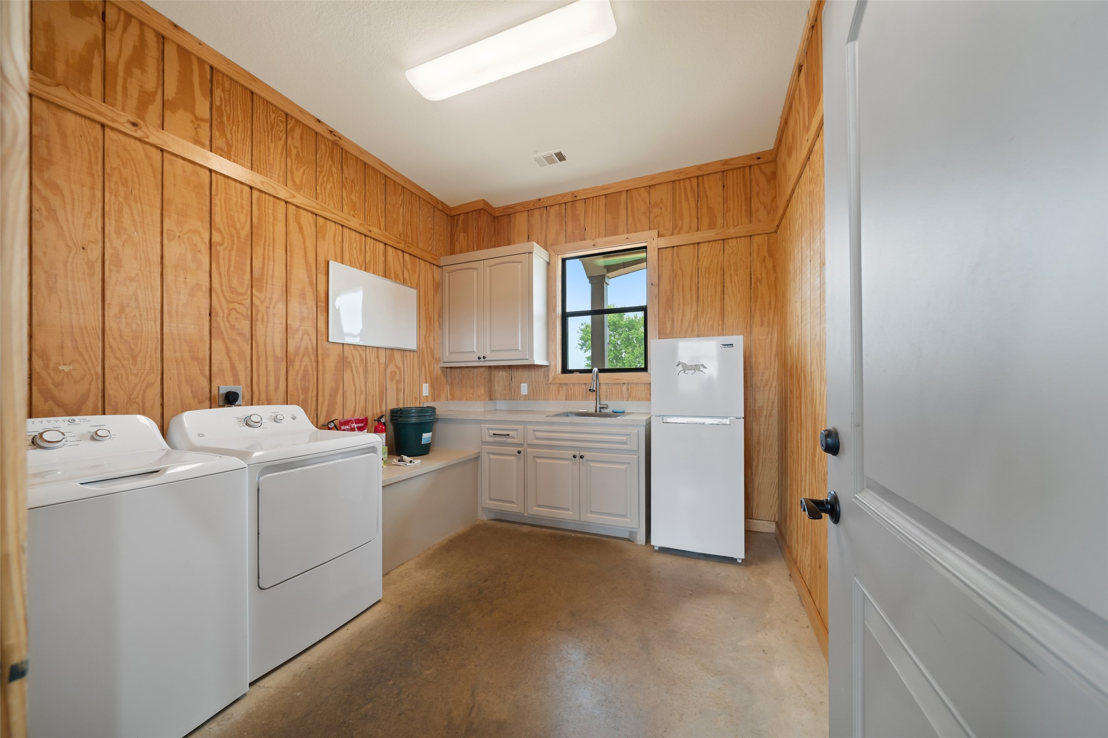30163 High Spirit Ranch Road Hempstead, TX 77445 - Photo 46 of 49 a room with dryer and washer