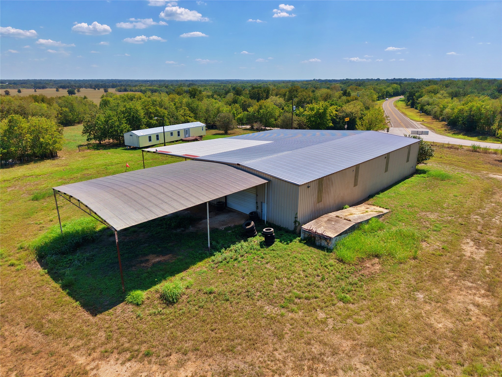 2035 Jeddo Road Rosanky, TX 78953 - Photo 12 of 15 Aerial view of property and surrounding area featuring a forest