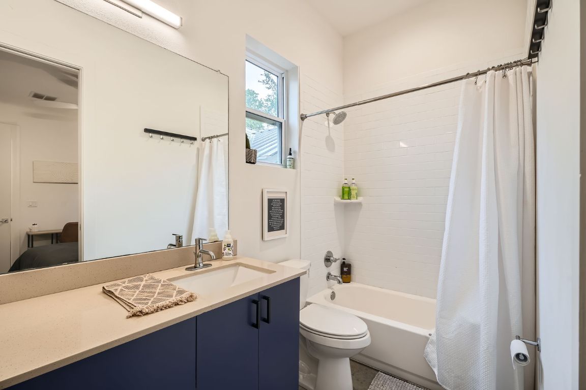 2601 Francisco Street, Unit B Austin, TX 78702 - Photo 12 of 30 a bathroom with a sink a toilet and shower